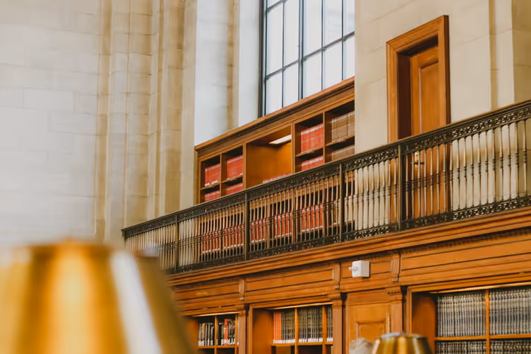 Library with wooden shelves and books