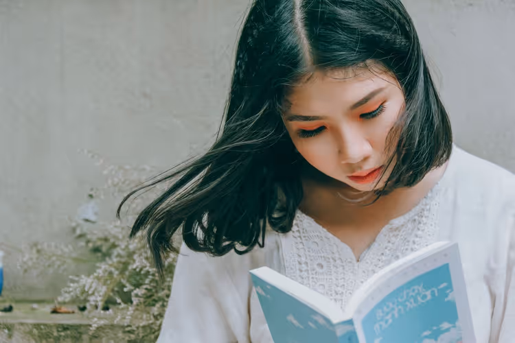 Close-up of a book in hands, reading up close