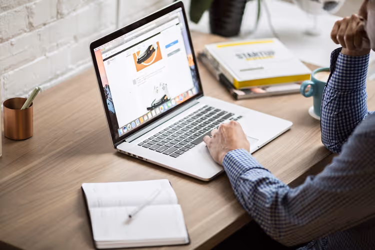 Desk with a laptop and publishing results analytics