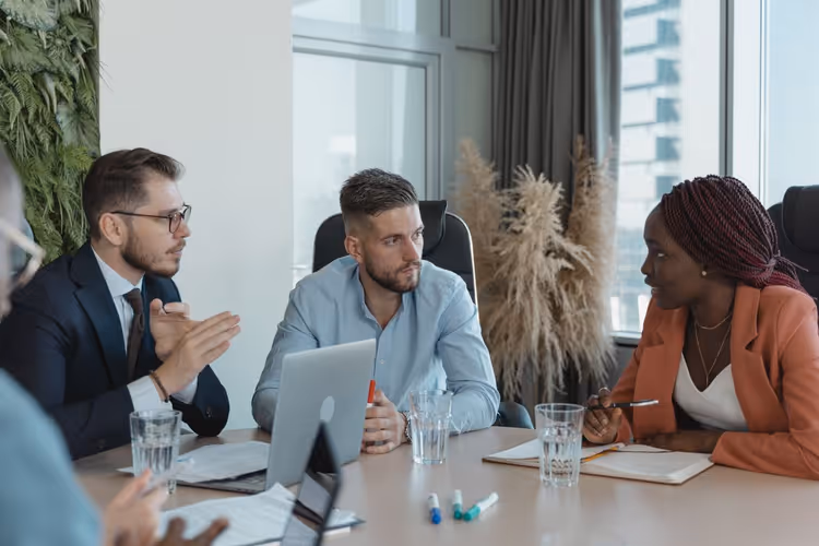 Colleagues discussing a content plan at an office meeting