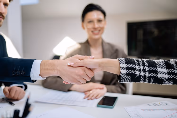 Business handshake closing a partnership agreement