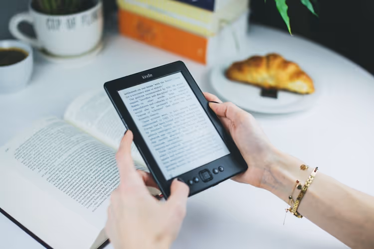 Reader holding an e-reader